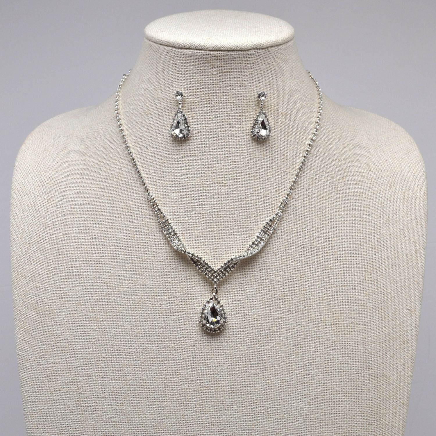 J15494S1S CL/S TWISTED TRDRP STONE SET