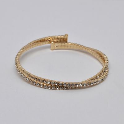 J83487B1G CLR/G  2 LINE TWSTD CUFF BRAC