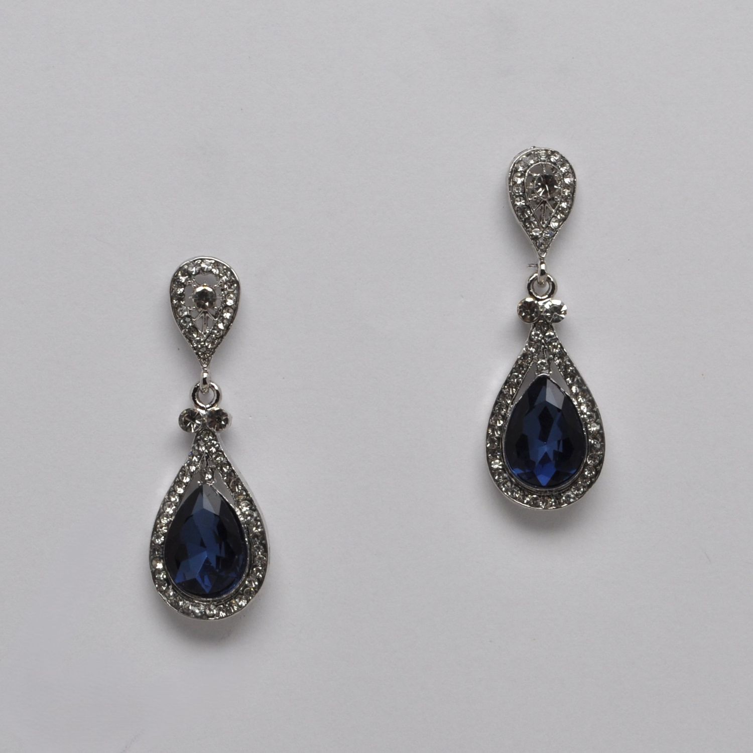 SI0005E8S NVY/CRY 2 PEAR CUT POST EARRING