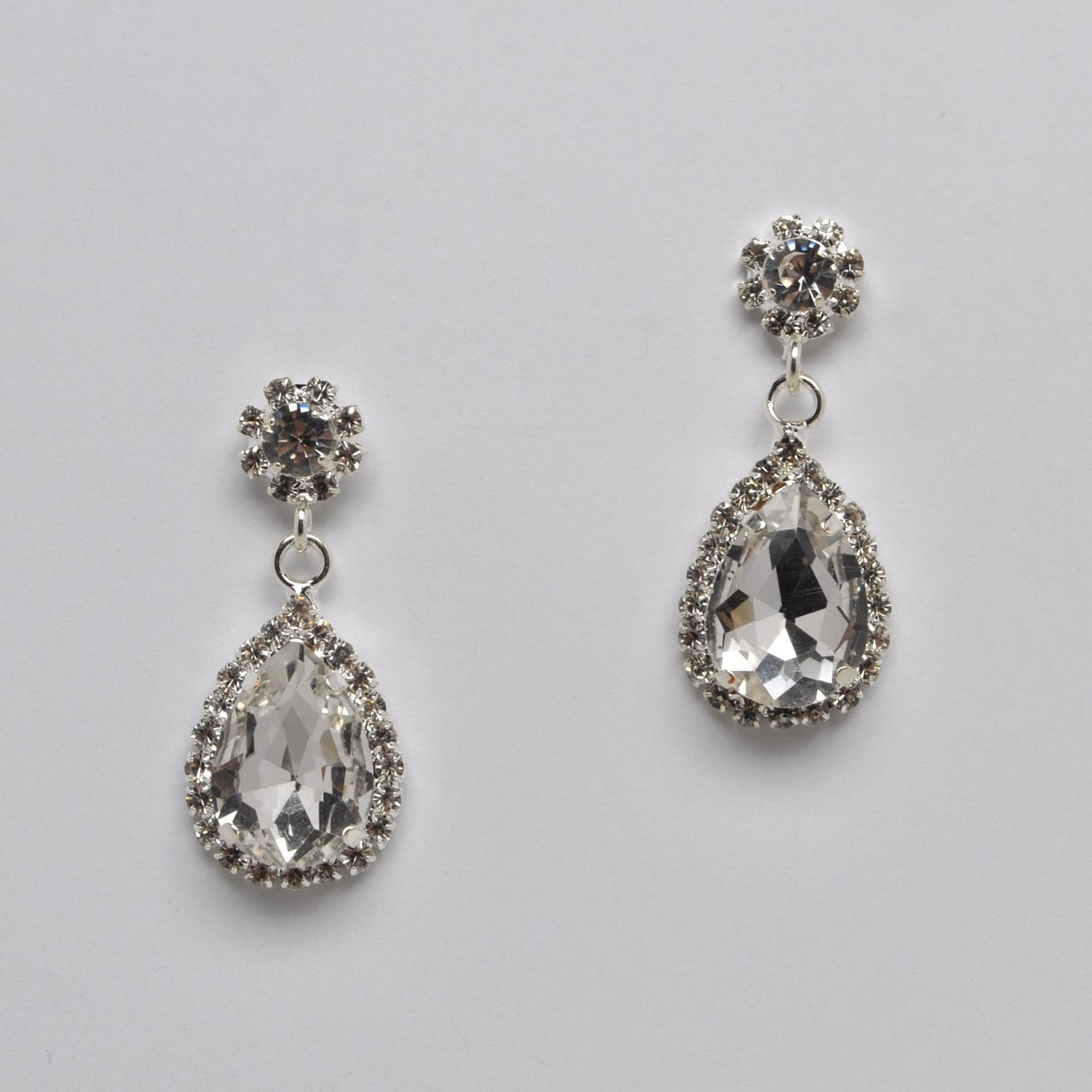 CC0061E1S CLR/S FLWR TEAR DRP BTTM LNKD ER