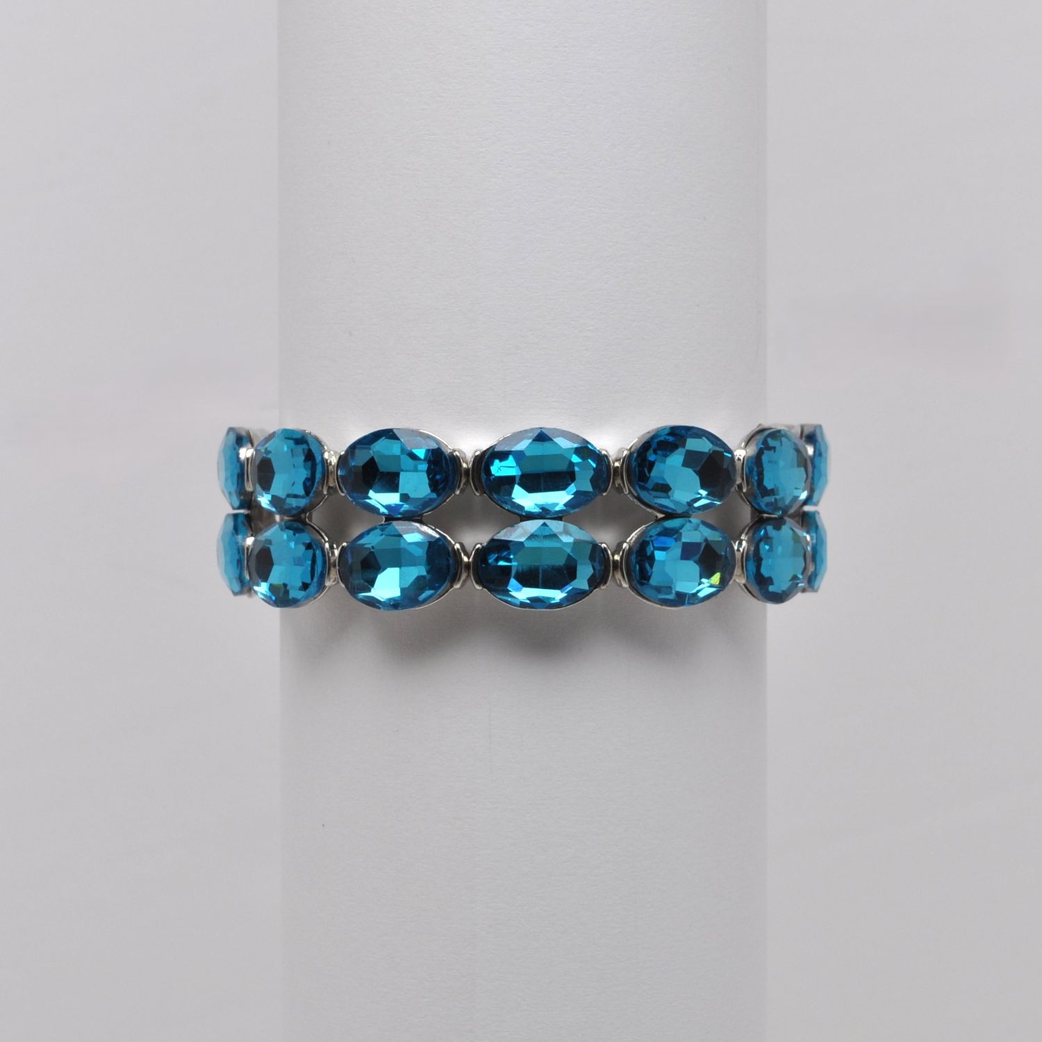 QQ2321B13S  AQUA/SIL  TWO ROW OVAL STONE STRETCH BRCLT