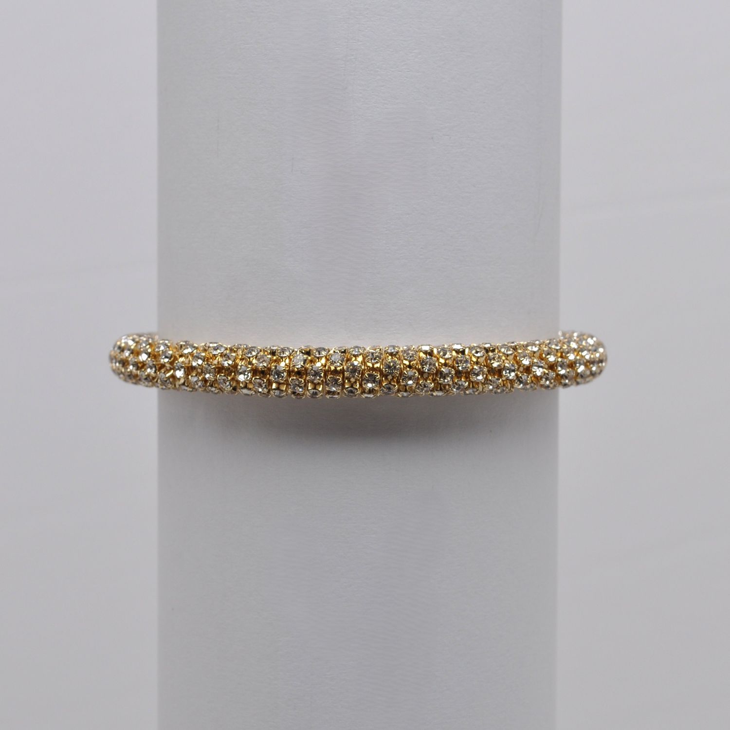 J84565B1G CLR/G  GOLD 7MM STRETCH TUBE BRAC