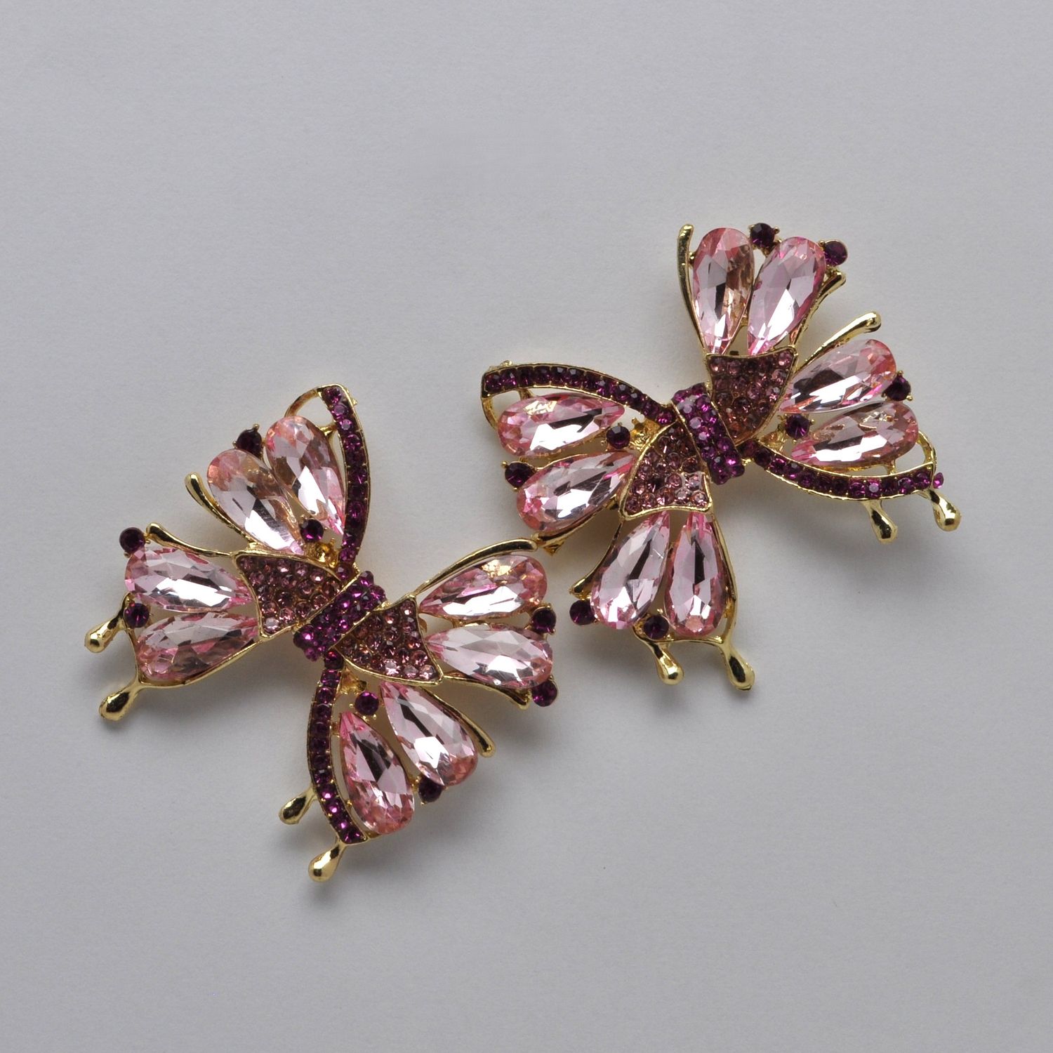 SI2520E33 LT-ROSE/GLD  BOW STYLE STN DNGLE EAR