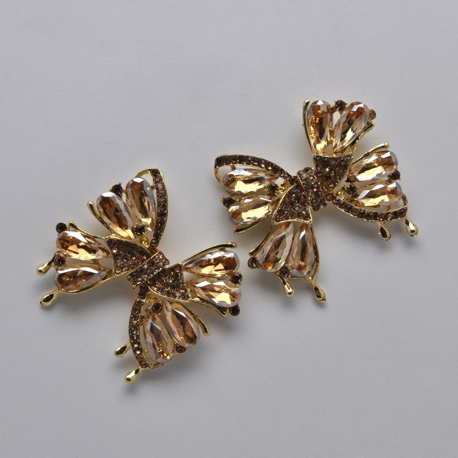SI2520E4G LT-LT-COL/GLD  BOW STYLE STN DNGLE EAR