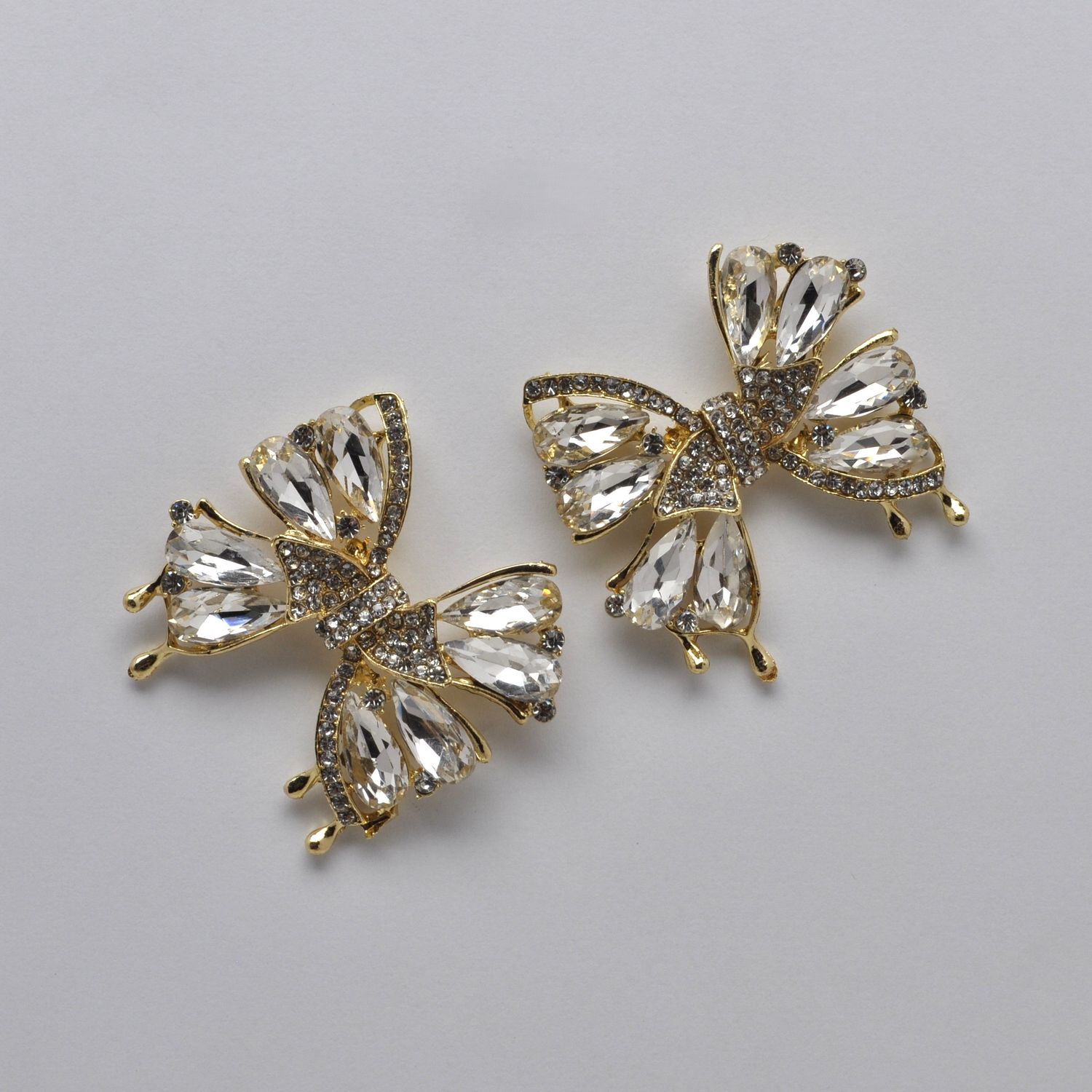 SI2520E1G LT-CRYS/GLD  BOW STYLE STN DNGLE EAR