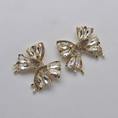 SI2520E1G LT-CRYS/GLD  BOW STYLE STN DNGLE EAR