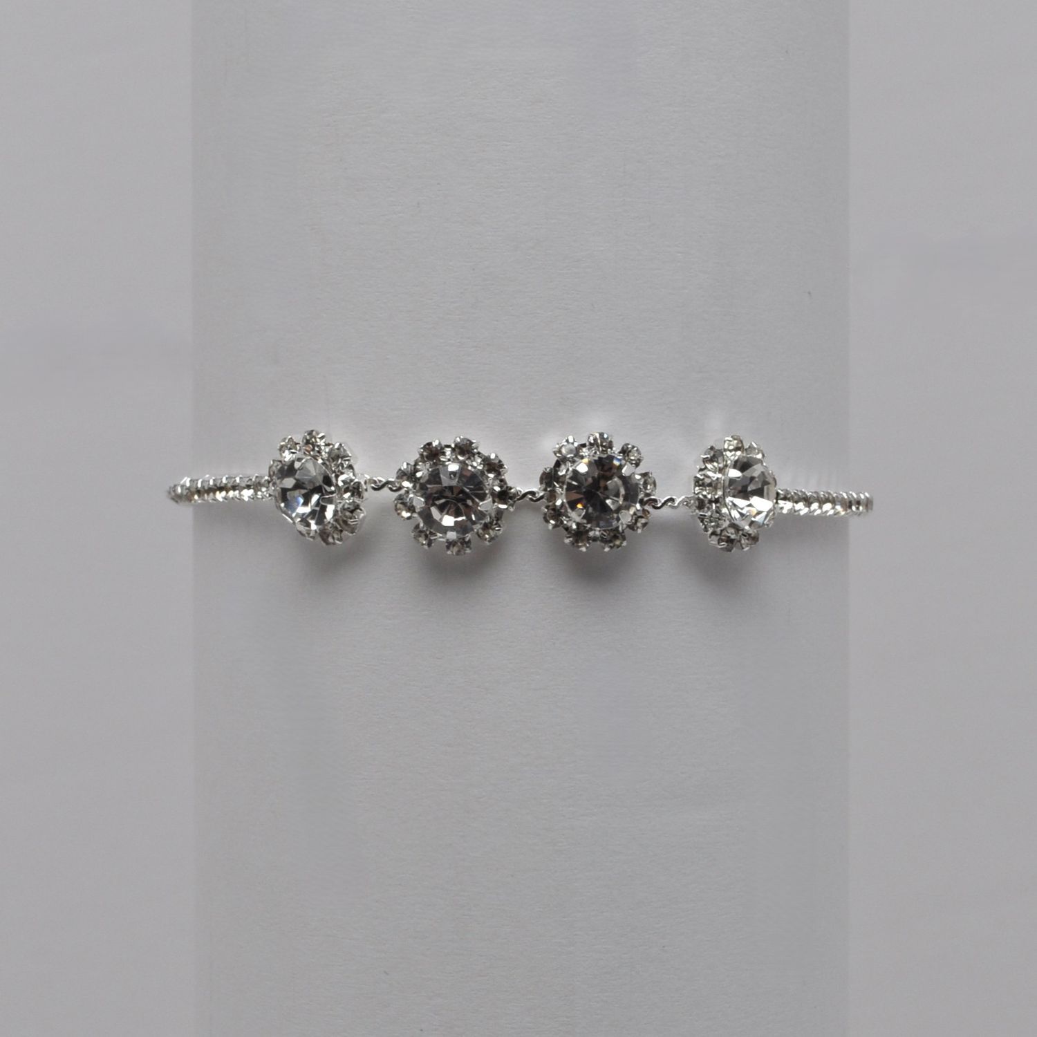 J84635B1S CRY/SIL 4 FLOWER SLIDE BRACELET