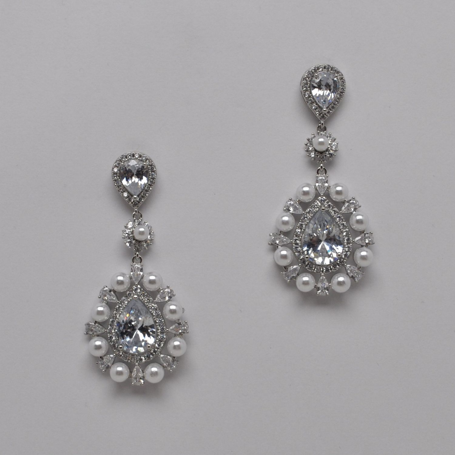 HJ001E39S CZ/PRL/S CLSTR TRDRP DNGLE CENTER MARQUISE EAR