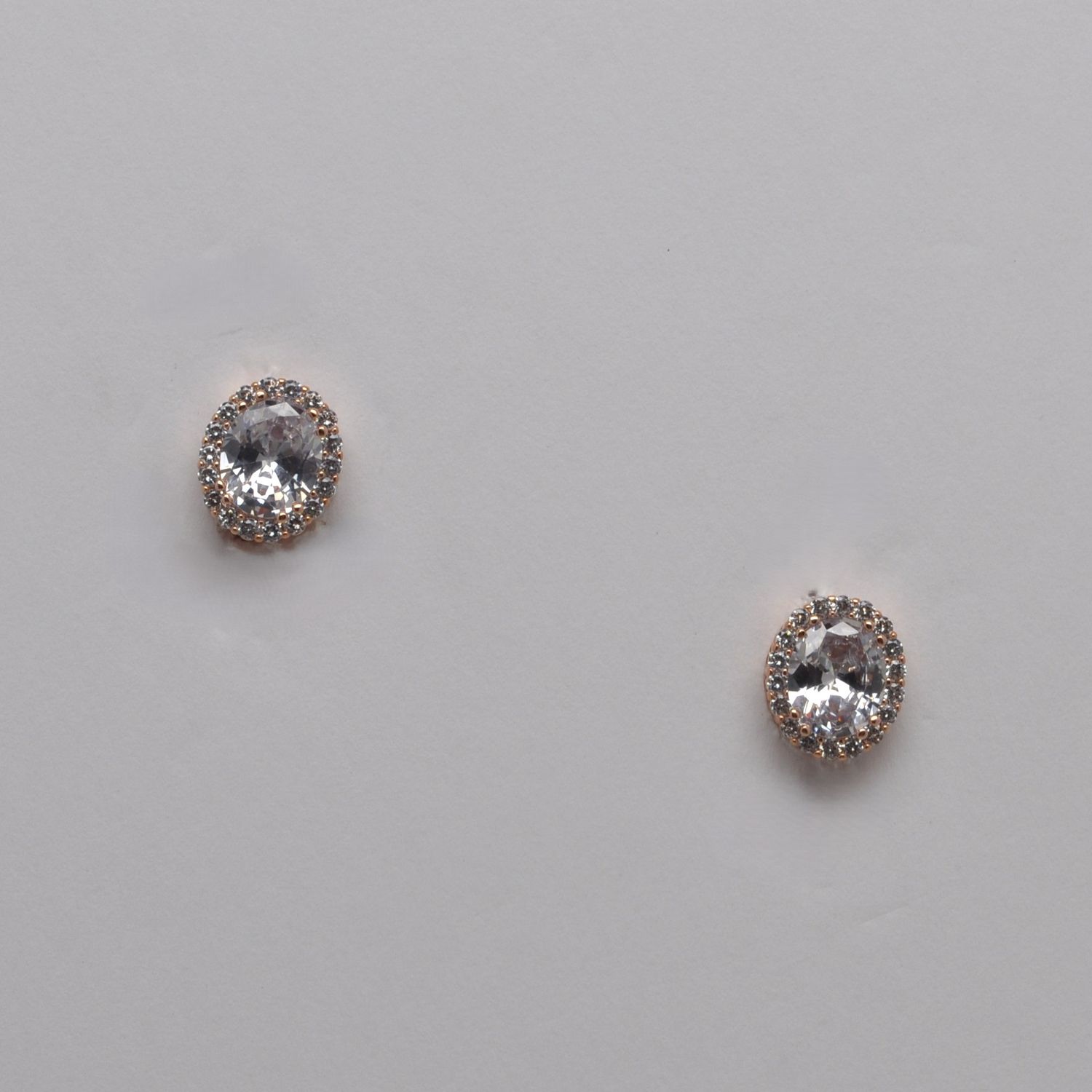CJ1476E1RG CZ/RG  CLIP ON OVAL STUD  STONES EARR