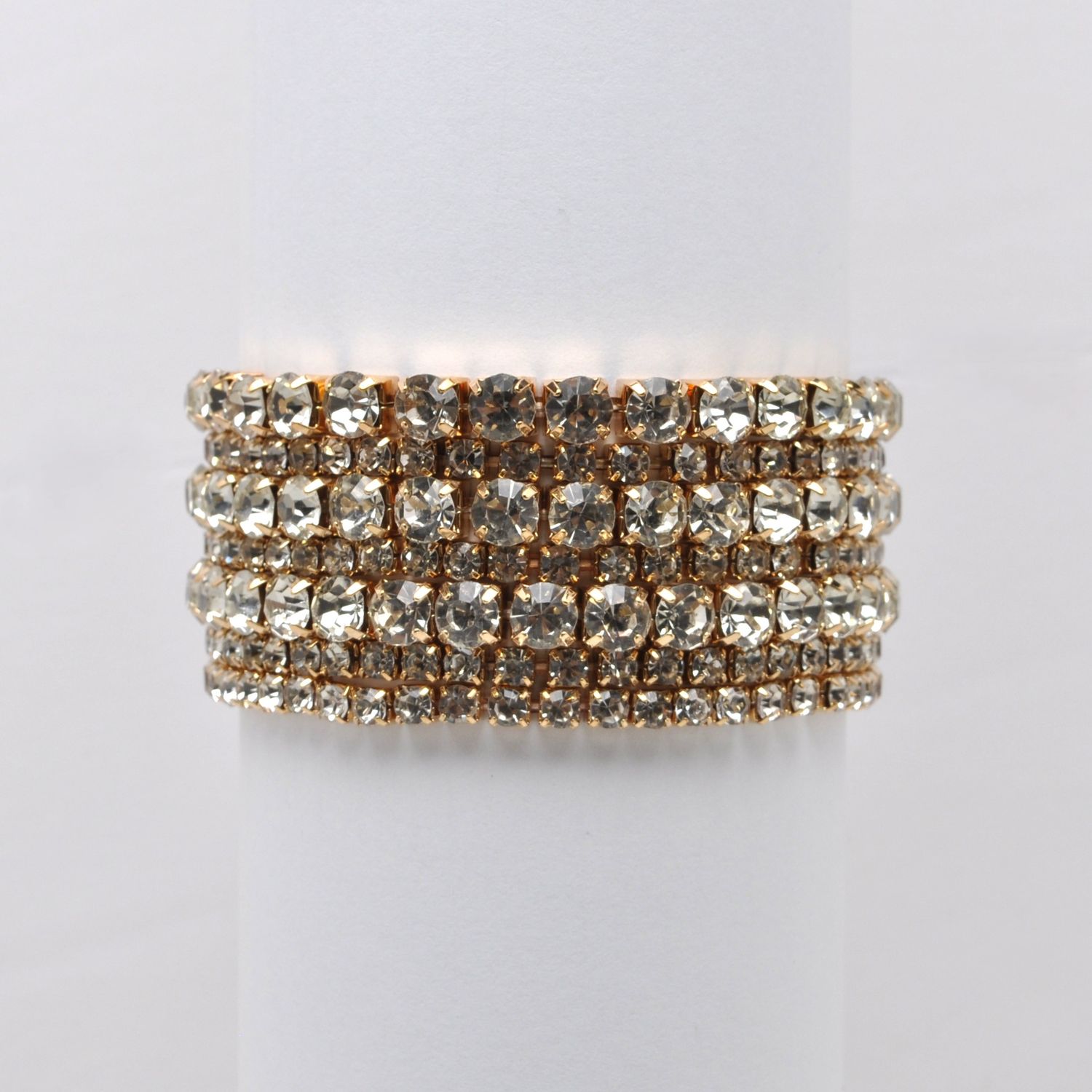 J84688B1G CLR/G MULTI STRAND RHINESTONE BRAC