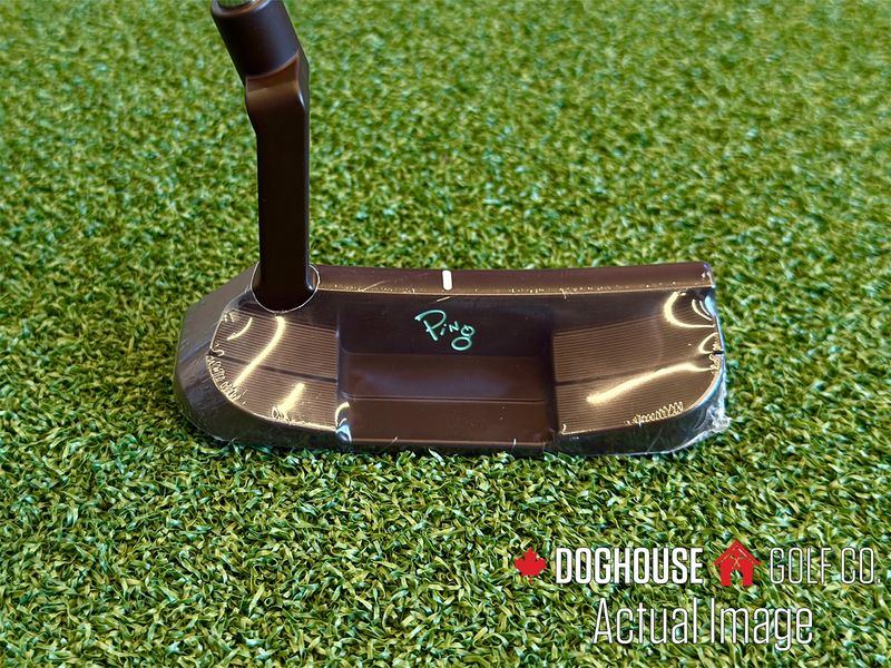 ping pld milled putter on golf turf, showing the back of the putter