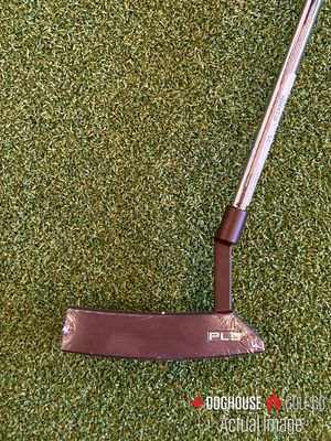 ping pld milled putter on golf turf, showing the face of the putter