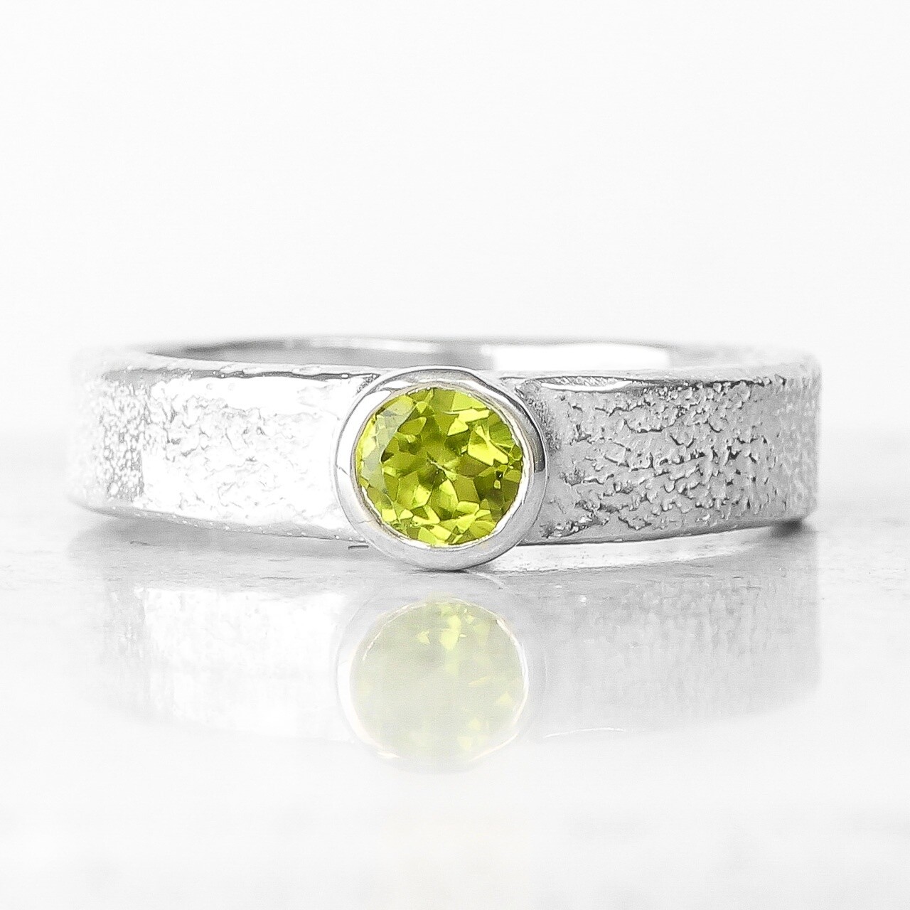 melted silver ring with faceted peridot by fi mehra