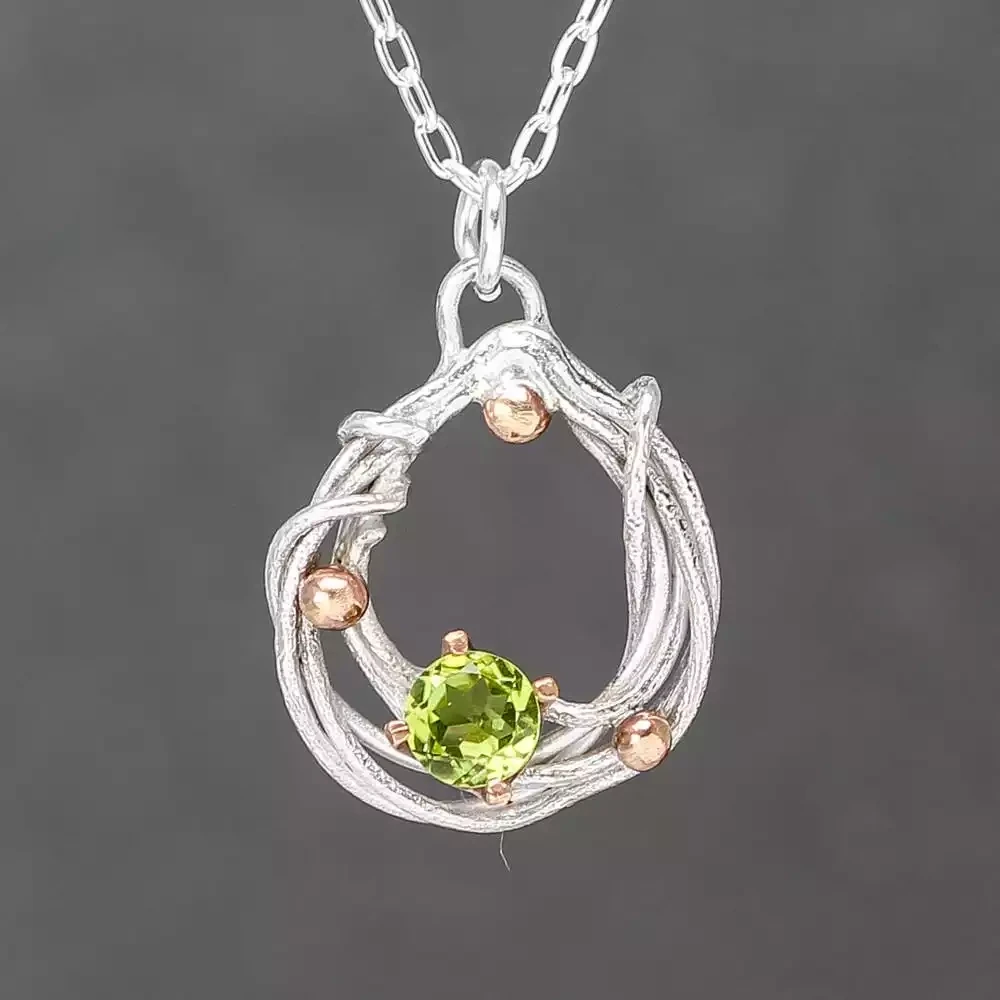Bejewelled Squiggle Peridot, Silver and Bronze Pendant by Xuella Arnold