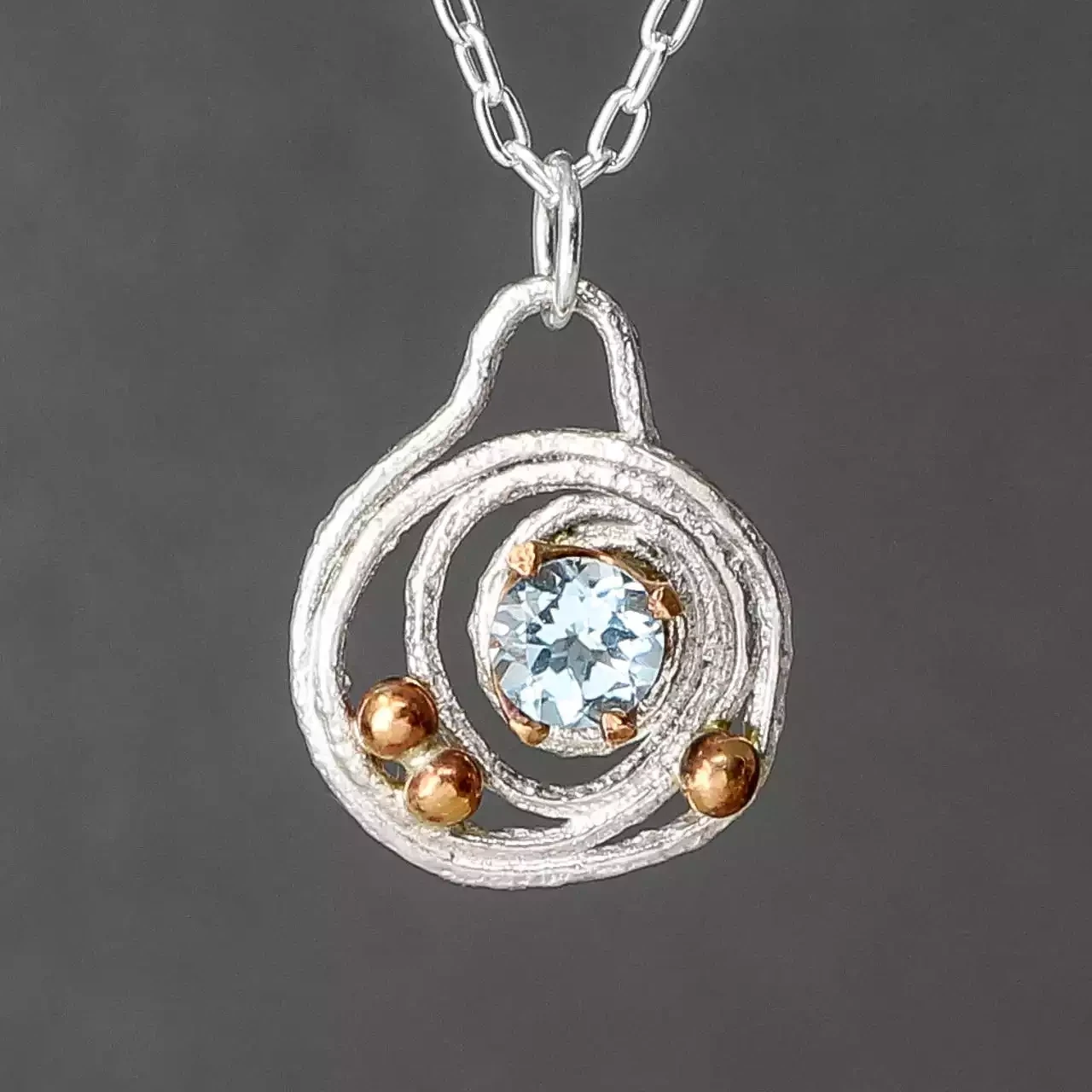 Bejewelled Squiggle Topaz, Silver and Bronze Pendant by Xuella Arnold