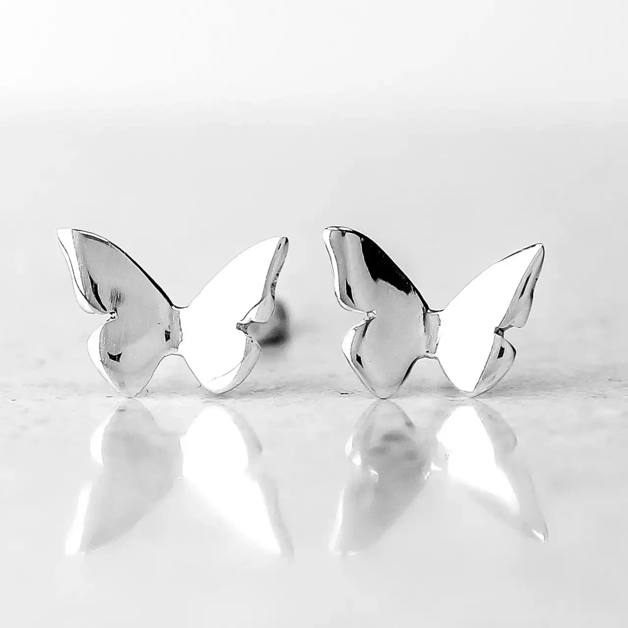 Butterfly Silver Stud Earrings by Linda Macdonald