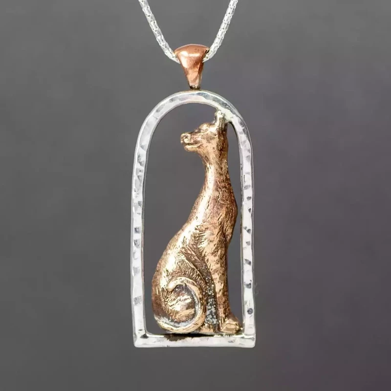 Cat in Window Silver and Bronze Pendant by Xuella Arnold