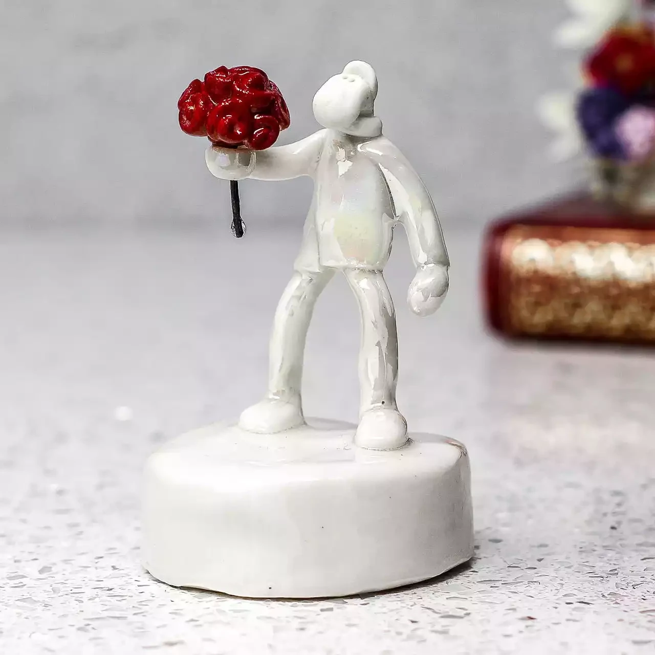 Ceramic Man With Bunch Of Roses Miniature Sculpture by Andrew Bull