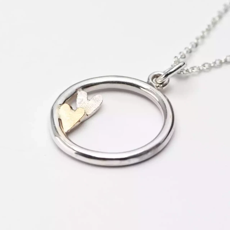 Circle with Scratchy Hearts Pendant with 9ct Gold Details by Fiona Mackay