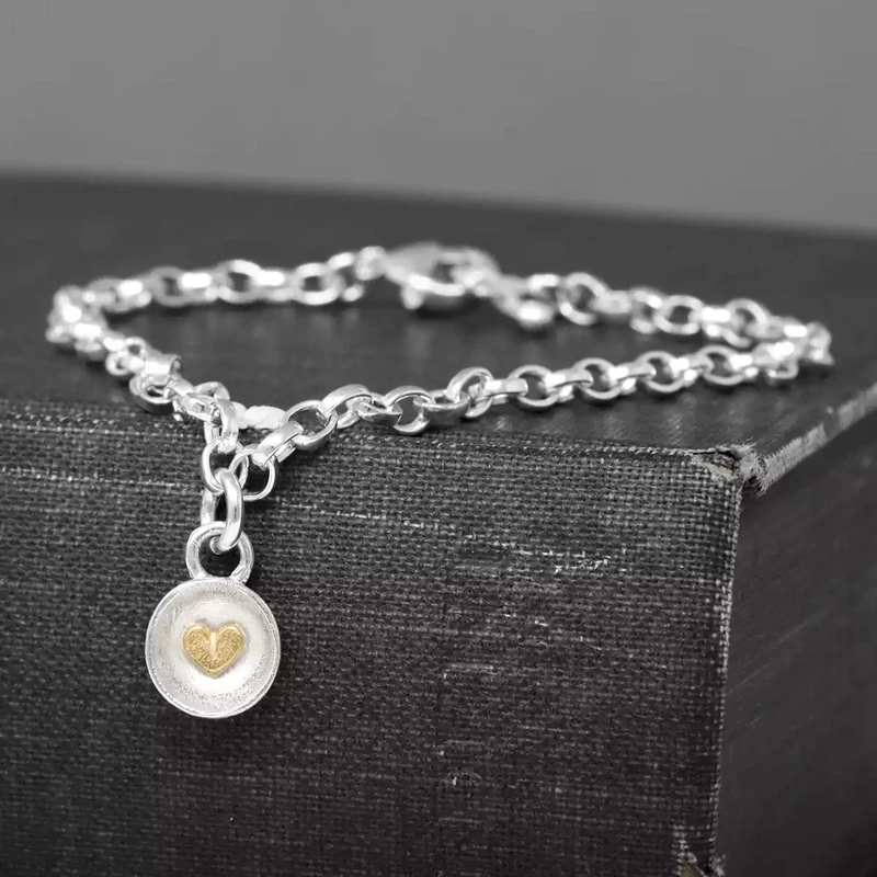 Concave Charm With Gold Heart on Silver Bracelet by Fi Mehra