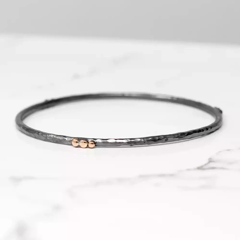 Hammered Slim Oxidised Silver Bangle With Trios of Rose Gold Balls by Fi Mehra