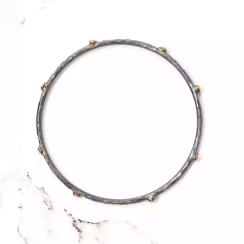 Hammered Slim Oxidised Silver Bangle With Eight Rose Gold Balls by Fi Mehra