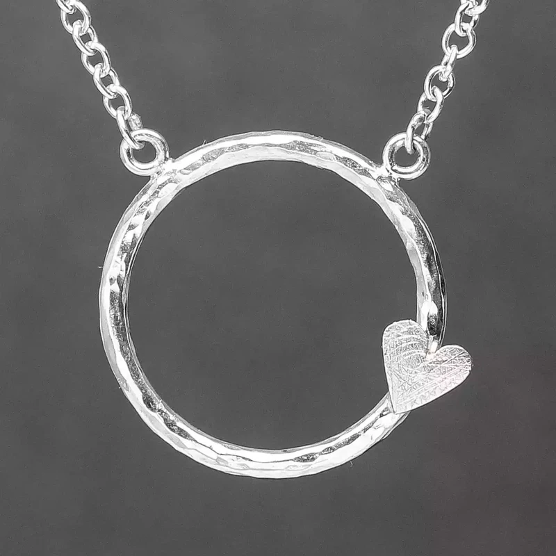 Hammered Circle with Scratchy Heart Silver Necklace by Fiona Mackay