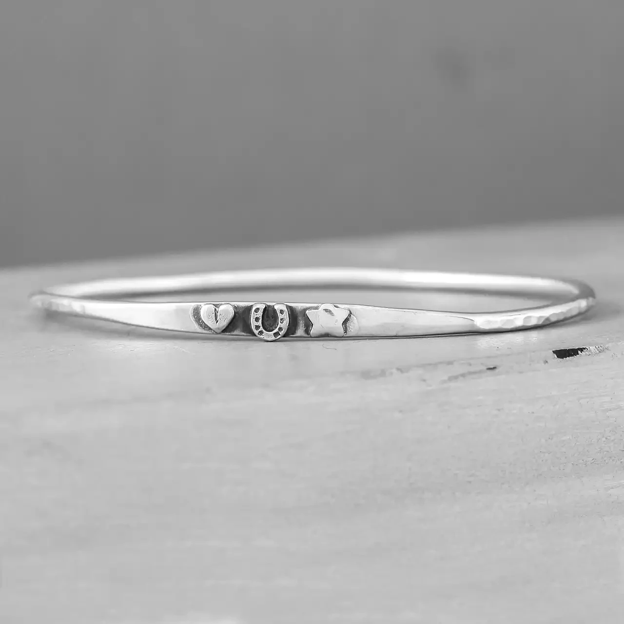 Love Luck and Success Charm Slim Silver Oval Bangle by Fi Mehra