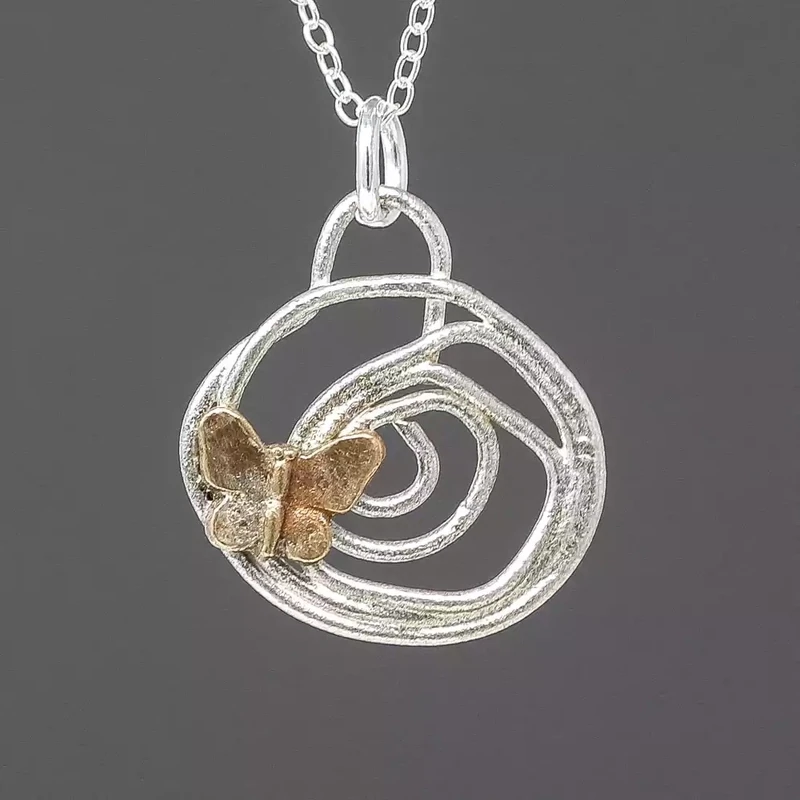 Little Butterfly Silver and Bronze Pendant by Xuella Arnold