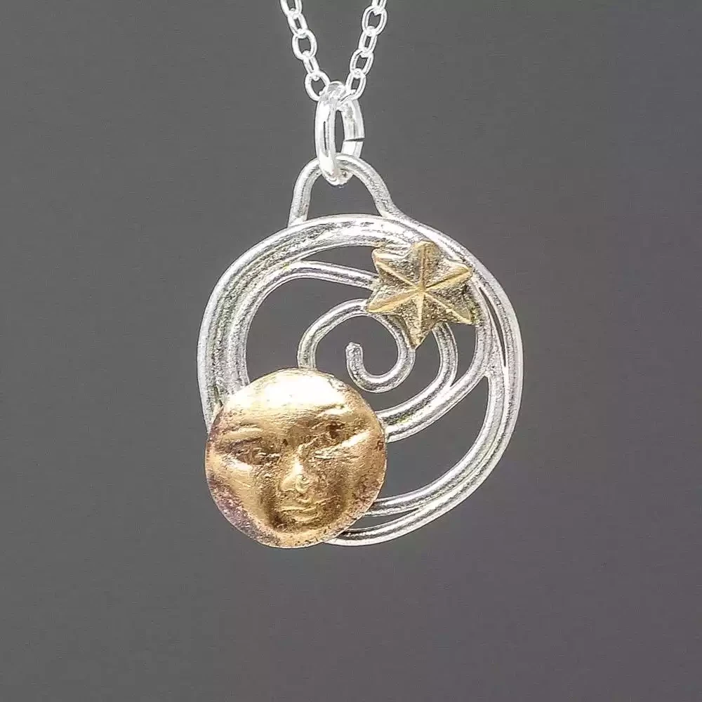 Moon and Star Bronze and Silver Pendant by Xuella Arnold