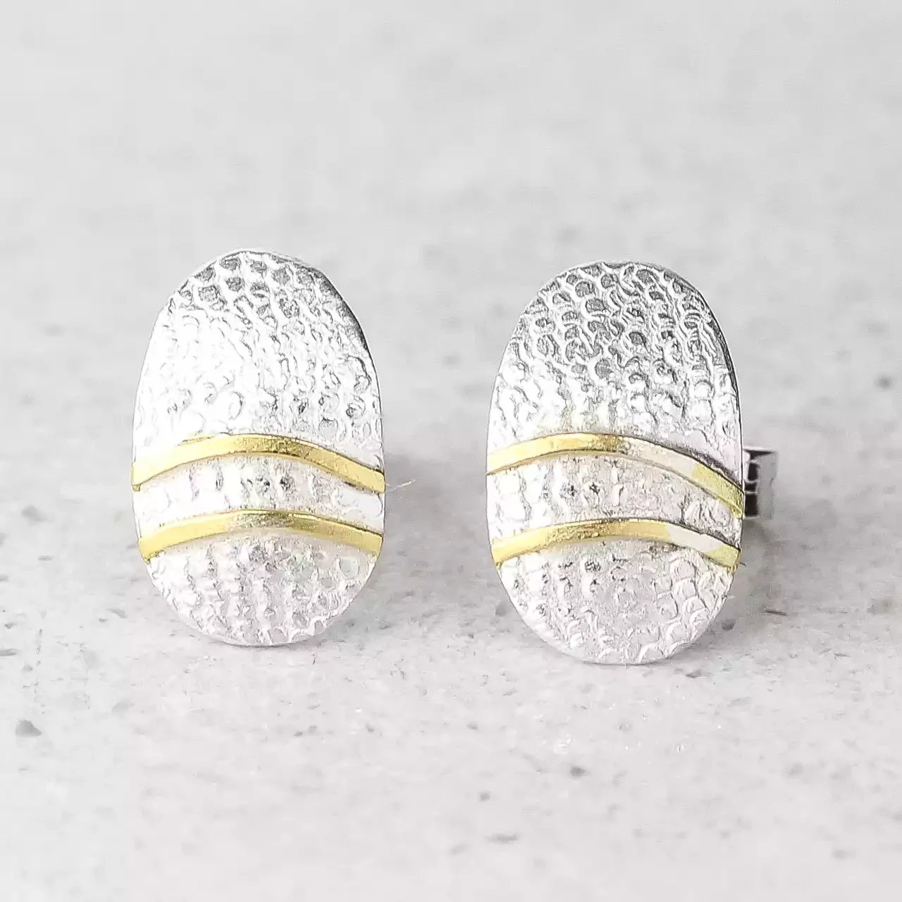 oval silver and gold lines stud earrings by adele taylor