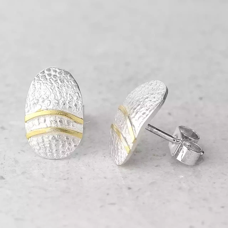 oval silver and gold lines stud earrings by adele taylor