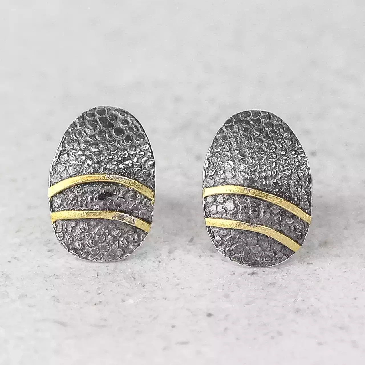 oval oxidised silver and gold lines stud earrings by adele taylor