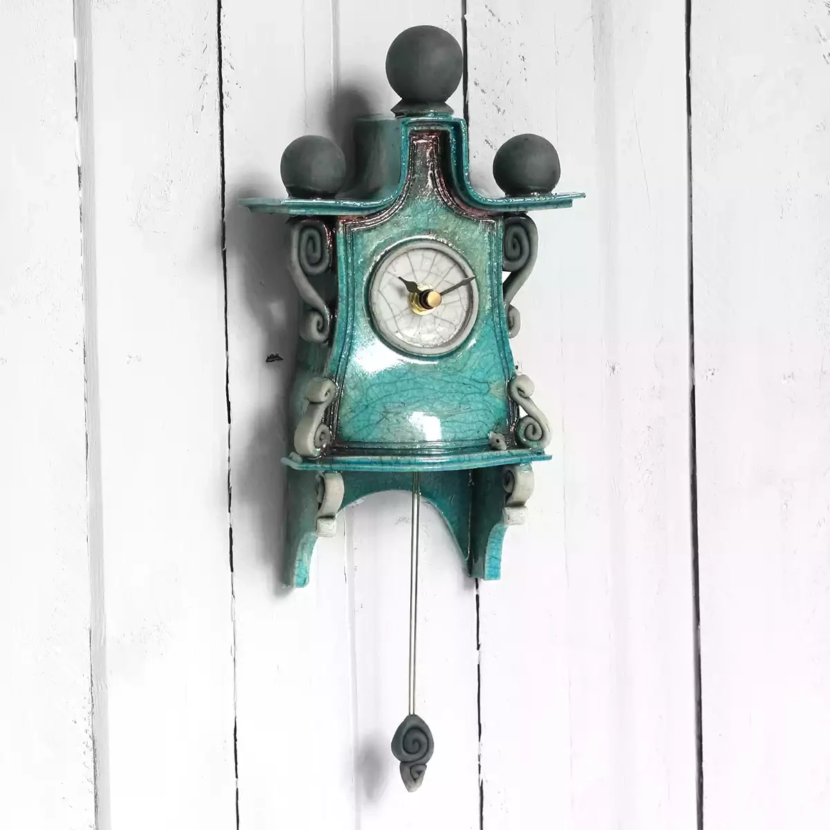 quirky ceramic pendulum wall clock - small type A - turquoise type A by ian roberts
