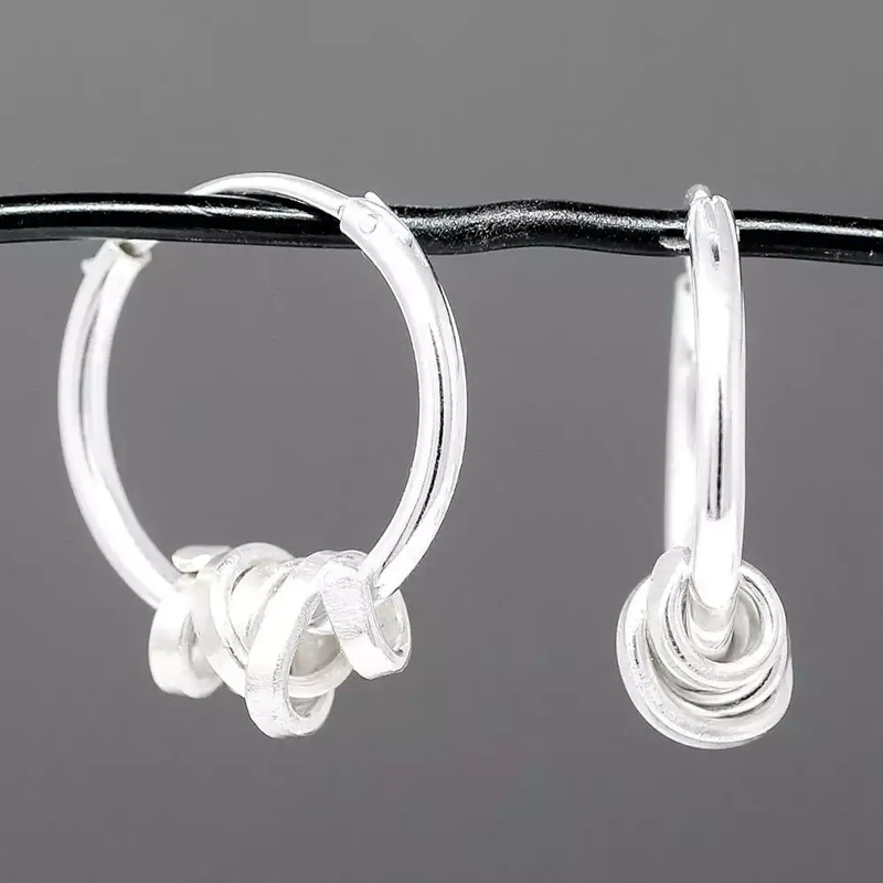 Ribbon Moving Silver Hoop Earrings by Fiona Mackay