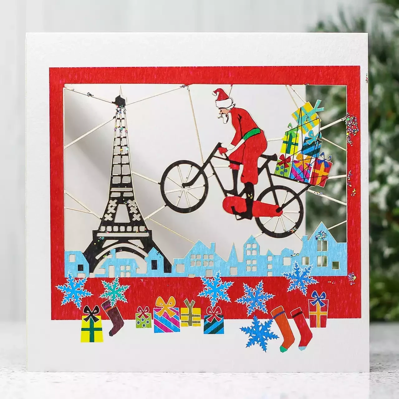Santa on Bike Over Eiffel Tower Glitter Christmas Card by Forever Cards
