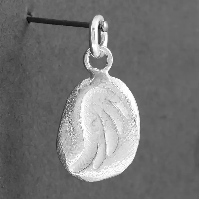 Stamped Wing Silver Charm by Fi Mehra