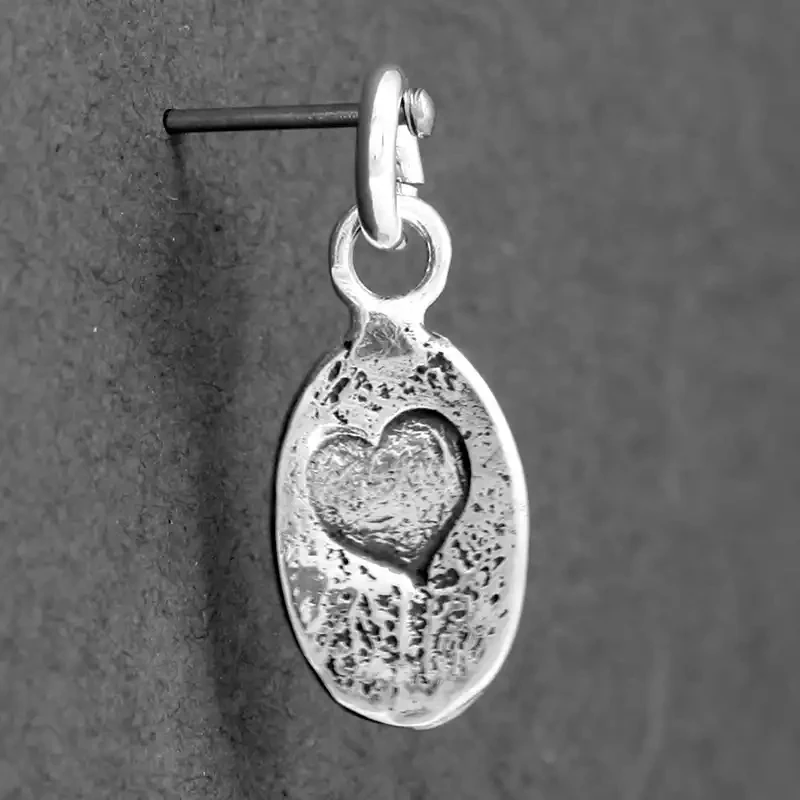 Stamped Heart Oval Silver Charm by Fi Mehra