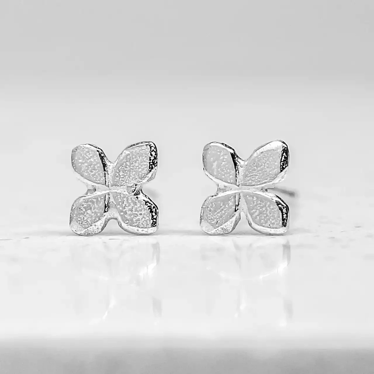 Tiny Silver Flower Stud Earrings by Fi Mehra
