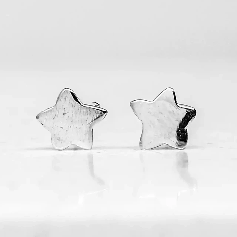 Tiny Silver Star Stud Earrings by Fi Mehra