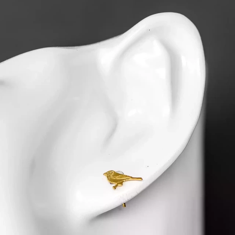 Tiny Bird Gold Plated Stud Earrings by Amanda Coleman