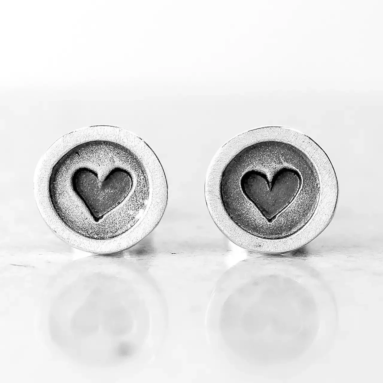 Wee Buttons Heart Oxidised Silver Stud Earrings by Linda Macdonald
