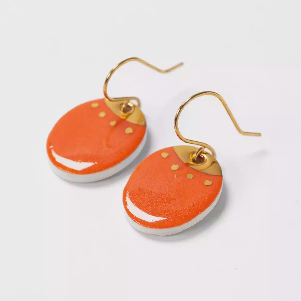 Ceramic Oval Drop Earrings With Gold Lustre Detail - Orange by Clay Blanca