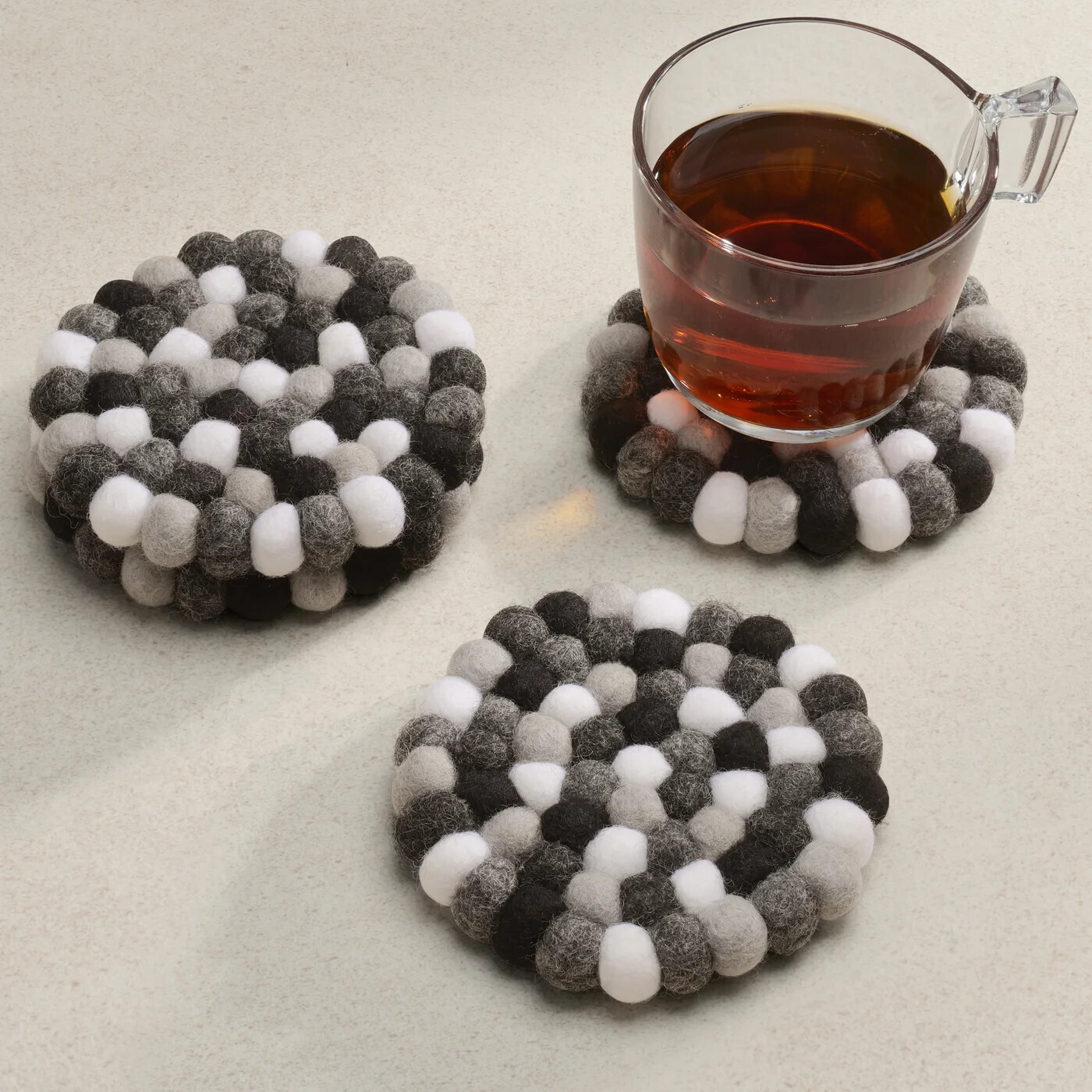 Felt Ball Four Piece Round 4&quot; Diameter Coaster Set Black/White/Grey