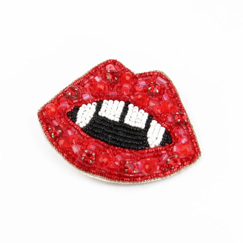 Beaded Red Fang Lip Brooch