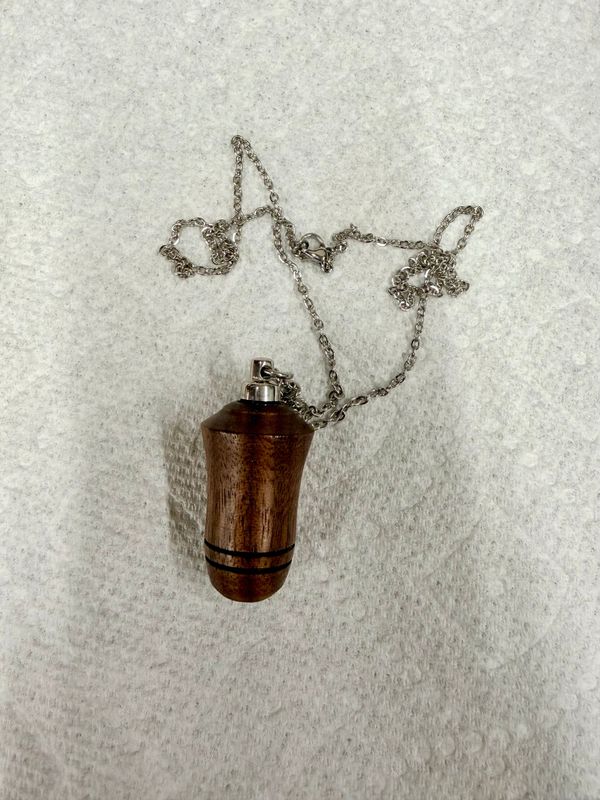 (Walnut).  Keepsake Ash necklace ,1 3/4" x 7/8"