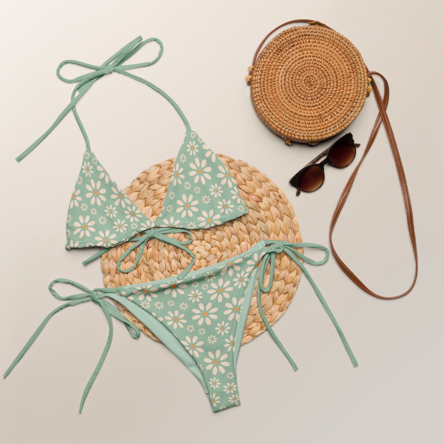 Pastel green recycled triangle bikini with retro floral daisy pattern in sizes 2XS-6XL