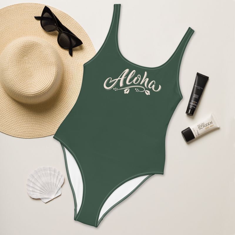 Olive green one-piece swimsuit with Hawaiian greeting. Sizes from XS to 3XL.