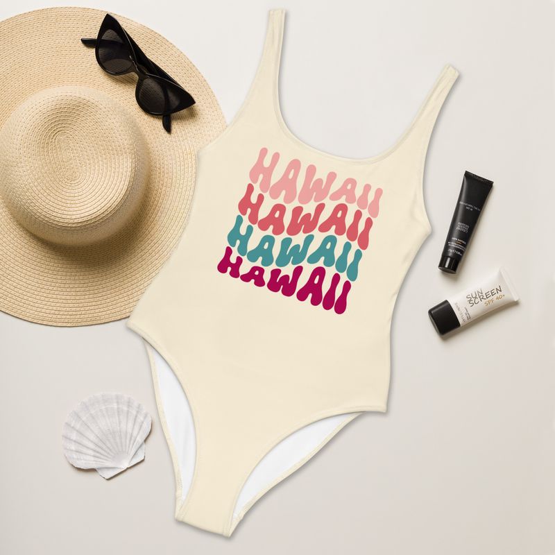 Retro pastel yellow one-piece swimsuit with Hawaii text written four times. Stunning fit.