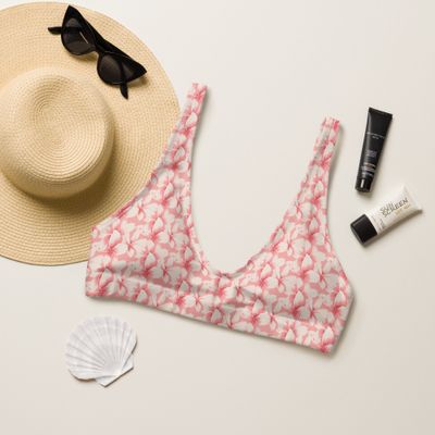 Frangipani pattern padded bikini top with blush pink lining.